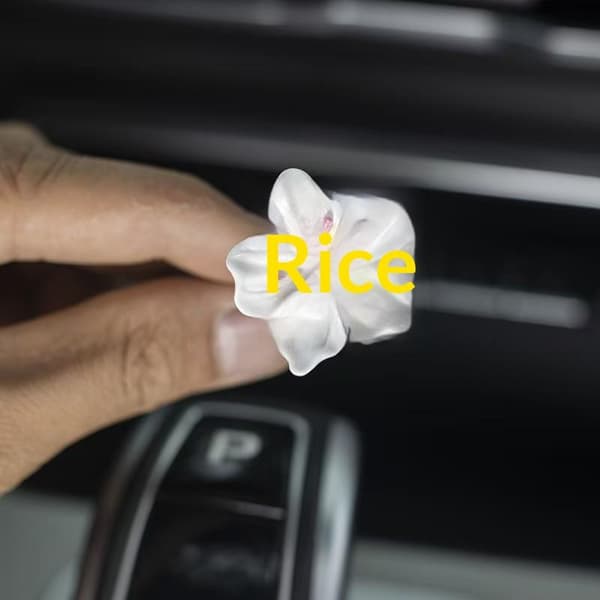2 stk. bilblomsterformede parfumeclips til klimaanlæggets udluftning Yellow