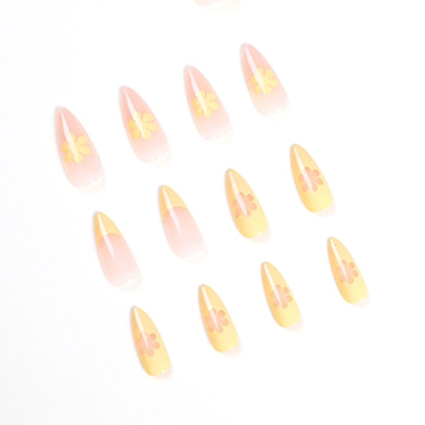 Paketet innehåller 24 press-on-naglar, korta gul-mandel konstgjorda naglar