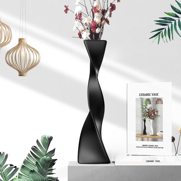 Tilføj et moderne touch til din indretning med en kreativ sort keramisk snoet højgulvvase - ideel til boligindretning og blomstervisning