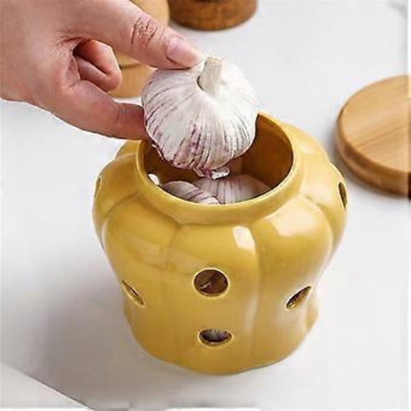 Keramisk vitlöksburk med lock, ihålig genombruten design för vitlök, ingefära, chilipeppar, förvaringsburkar, ljuslykta