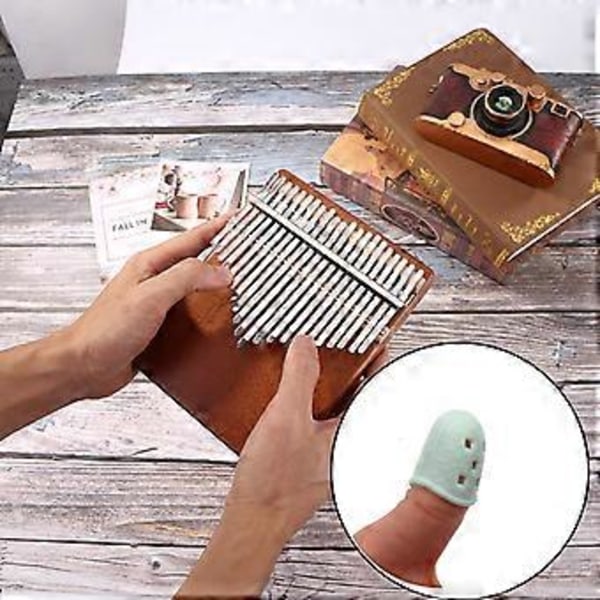 Färgglada Silikon Fingerborgar Urholkade Andningsbara Spela Kalimba Fingerärm