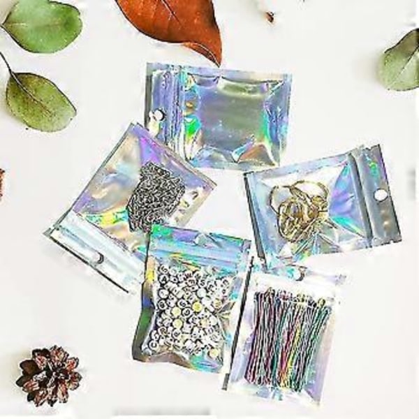100 kpl Holografisia pakkauspusseja, pieni lahjapussi, Mylar-pussi, vetoketjullinen lukko, hajunpitävä