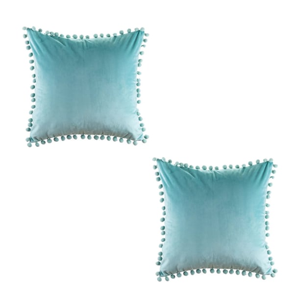 Dekorativa kuddfodral i polyestervelour, elegant design med pom-poms och osynlig dragkedja för enkel skötsel