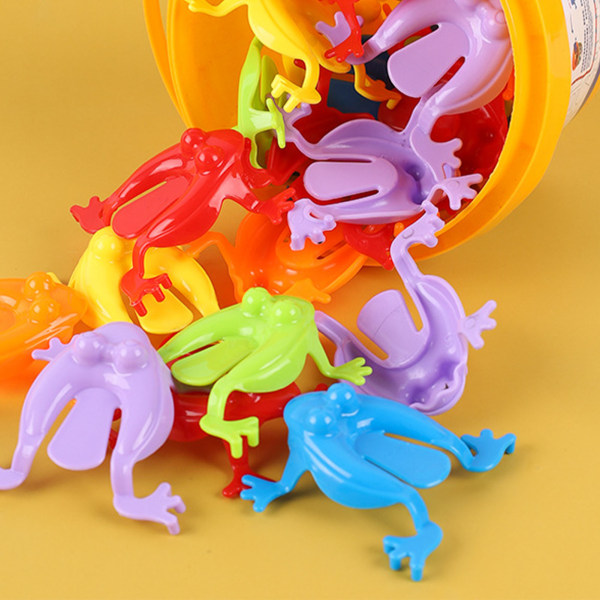 12ST Färgglada groda hoppa leksaker Fingerpressande hoppande grodor med hink Barn studsande set Presentförpackning