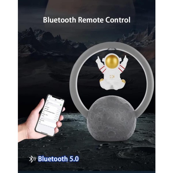Magnetisk levitation Bluetooth högtalare. Astronaut som flyter på