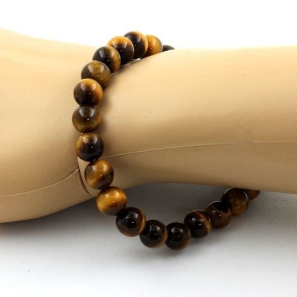 Stenar och mineraler. 8mm Tiger Eye Beaded Armband. Tillverkad i Frankrike.