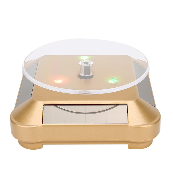 Solcellsdriven LED Elektrisk Roterande Turntable Displayställ för Smycken Telefon Guld med Ljus