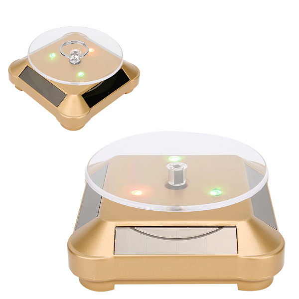 Solcellsdriven LED Elektrisk Roterande Turntable Displayställ för Smycken Telefon Guld med Ljus