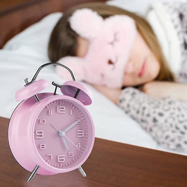 Kaksikelloinen herätyskello taustavalolla, paristokäyttöinen (paitsi akku), sopii raskaalle nukkujalle - vaaleanpunainen