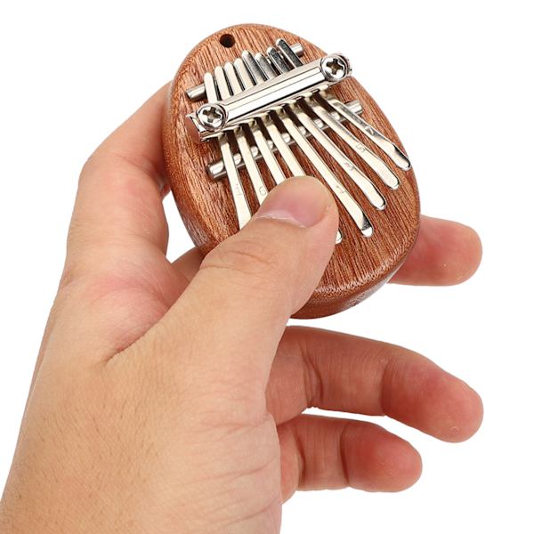 Tommelfingerklaver 8 tangenter Mini bærbart akrylmateriale Dekorationsgave MusikinstrumentOval råtræ