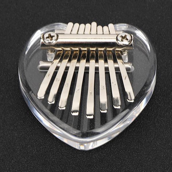 Tommelfingerklaver 8 tangenter Mini bærbart akrylmateriale Dekorationsgave Musikinstrument (hjerteformet krystal)