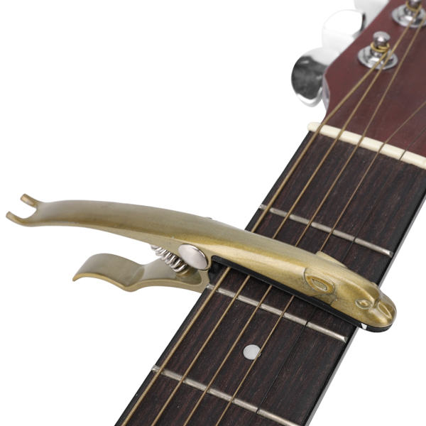 K72 Gitarr Capo Zinklegering Bronsfärgad Grodaformad Capo för Gitarr Ukulele Mandolin