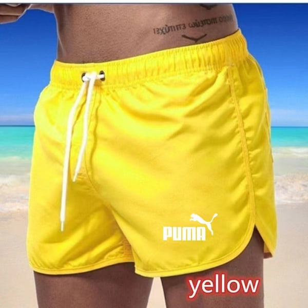Flerfärgade sportshorts i strandpolyester med tre punkts puma Yellow L