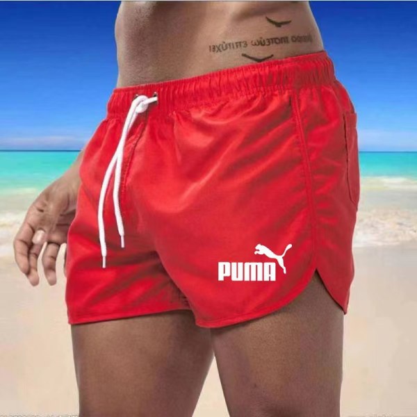 Flerfärgade sportshorts i strandpolyester med tre punkts puma Red S