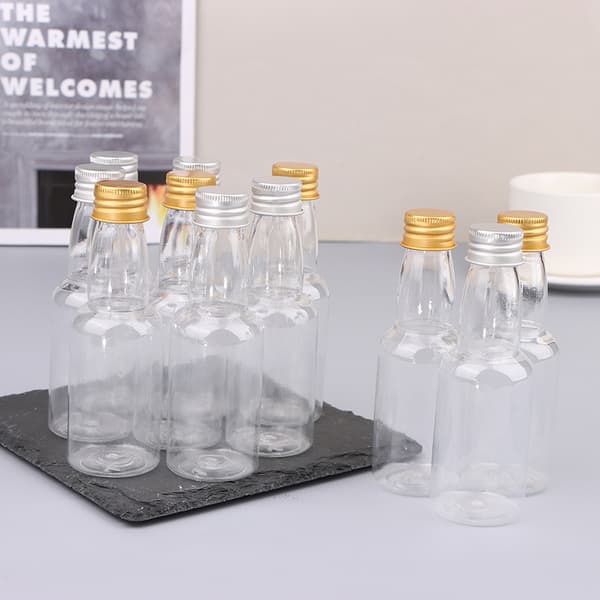 10 st 50 ml klara PET återfyllningsbara små vinflaskor med läckagesäker Silver
