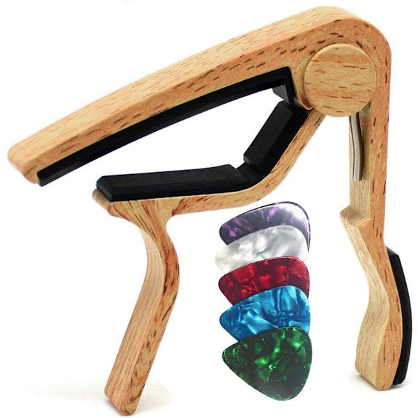 Gitarr-capo, levereras med 5 plektrum.