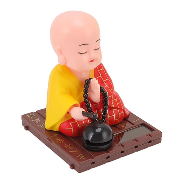Solcellsdriven buddhistisk munkdocka figurin för bilfönster och hotell