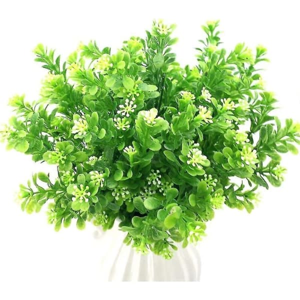 Sett med 4 kunstige planter. Kunstige dekorative busker. Simulerte planter. Laget av plast.