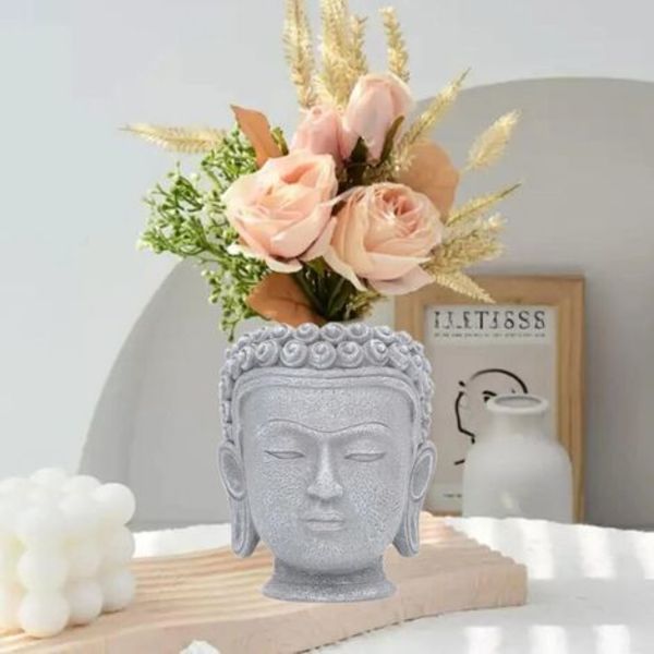 Blomsterpotte formet som et Buddha-hoved