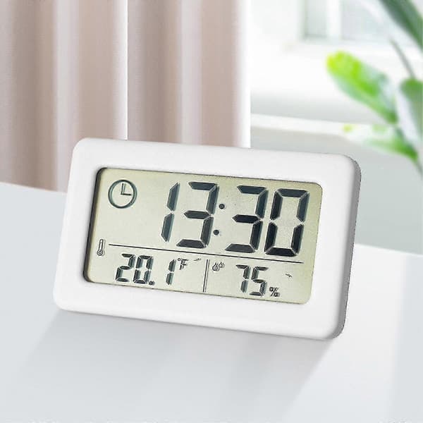 Rosa digital klocka med temperatur- och fuktighetsdisplay