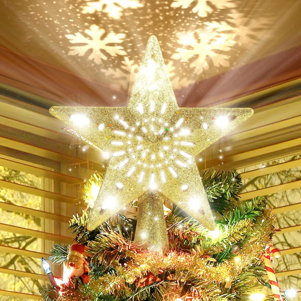 Julgran toppad med en stjärna upplyst av en roterande snöflinga-sh