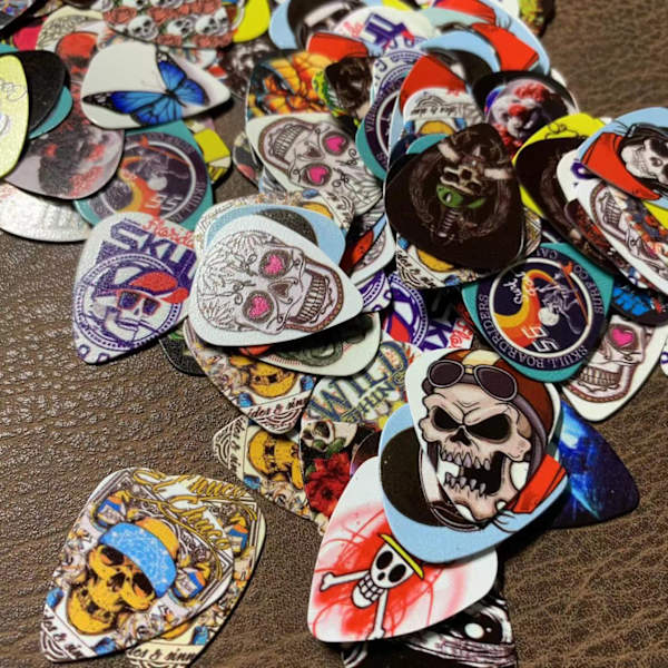 10 kappaleen plektrapakkaus, Skulls monivärinen - 0,46 mm