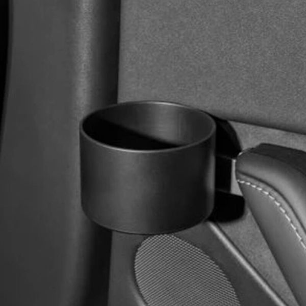 Vasemmalle ja oikealle automallien 3 ja Y autojen sisäovien juomapulloteline