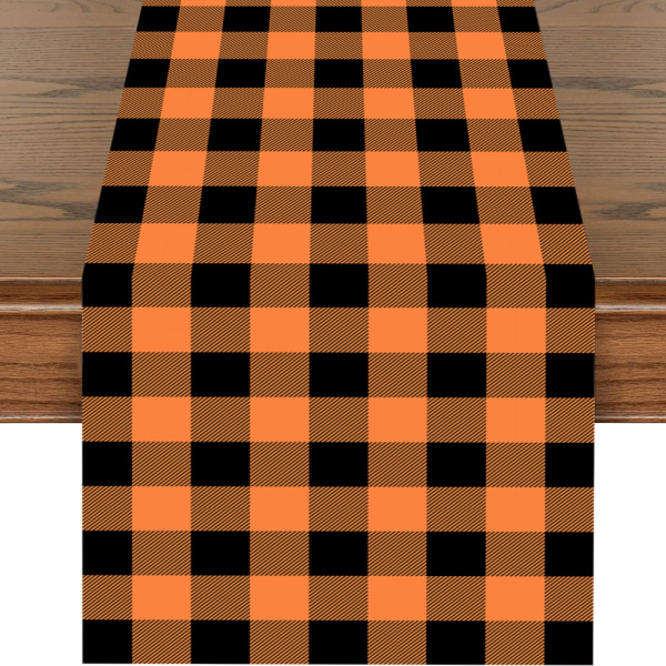 Joulupöytäliina oranssi ja musta ruudullinen kangas kohtauksen asettelu loma koristelu pöytämatto lippu