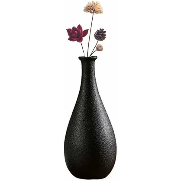 Ikebana dekorativ keramikkvase med kunstige blomster, svart