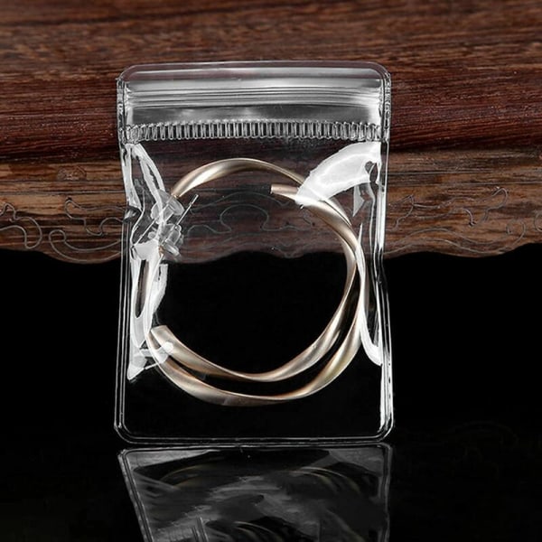 Transparent förvaringsbok Anti-Oxidation förvaringsväska (100 dragkedjor)