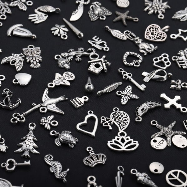 100 kpl hopeanvärisiä koruriipuksia DIY-korutarvikkeisiin, hopea
