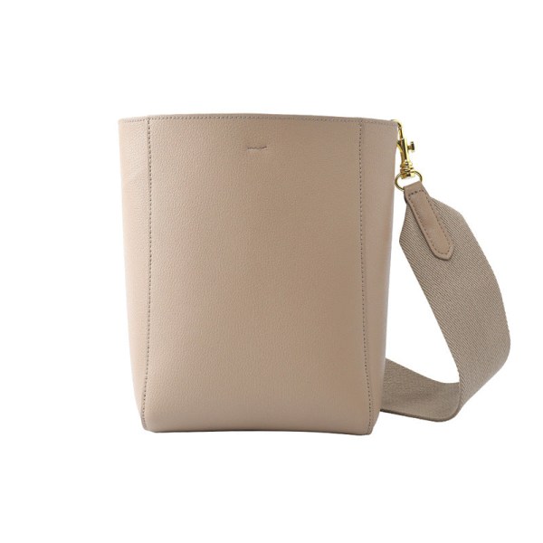 Kvinnor Läderhandväska Crossbody Bred axelrem Bucket Bag Enkel matchande axelväska Milky tea apricot