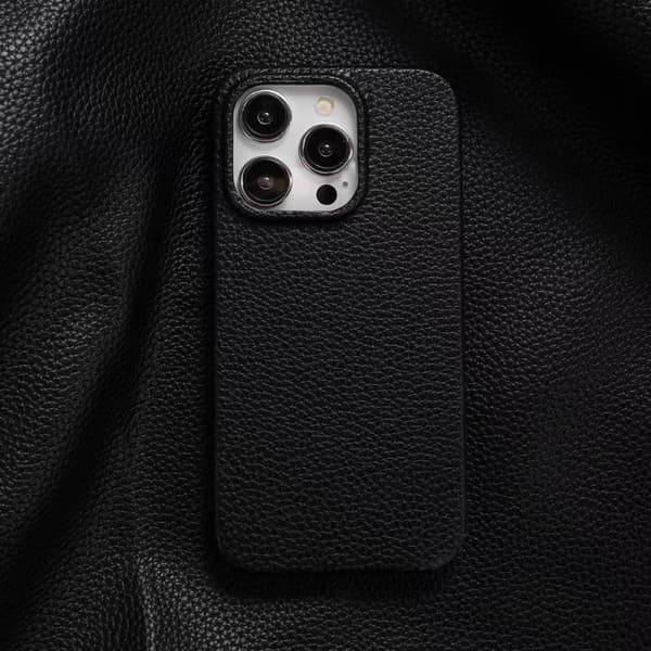 Deksel til iPhone 16 lychee mønster svart lær mønster enkel solid hardt fallsikkert