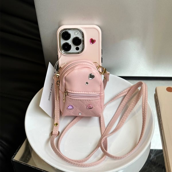 För iPhone 14 Pro TPU Skal Läder Liten Skolväska Design Mobilskal med Axelrem - Rosa
