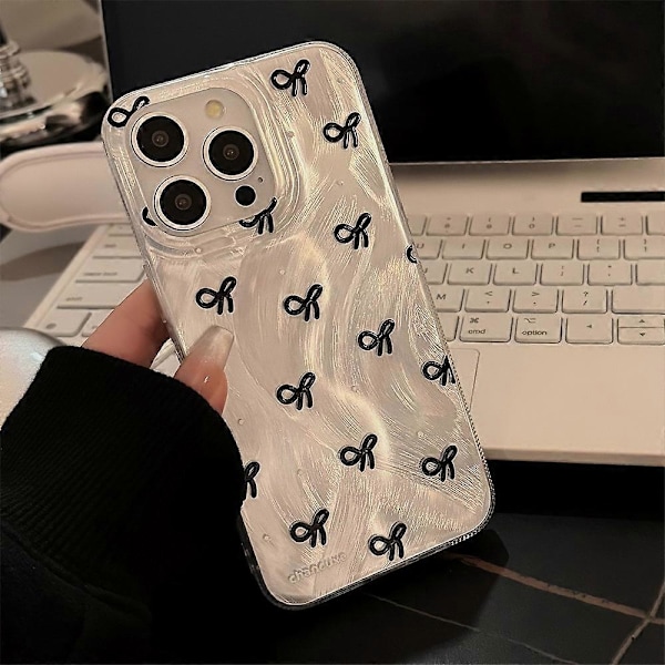 iPhone 15 Pro -kotelo, jossa rusettikuvio ja pehmeä TPU-puhelinkuori
