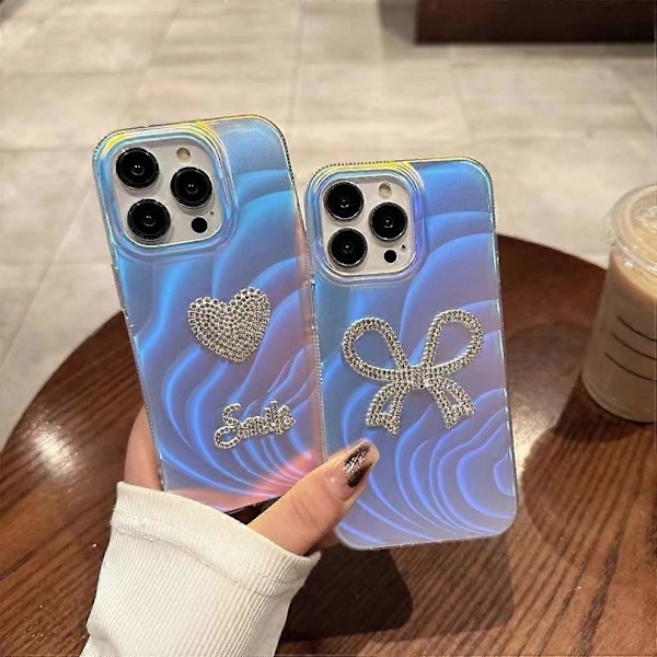 Skal till iPhone 14 Pro Max Strass Hjärta/Rosett IMD Akryl+TPU Mobilskal