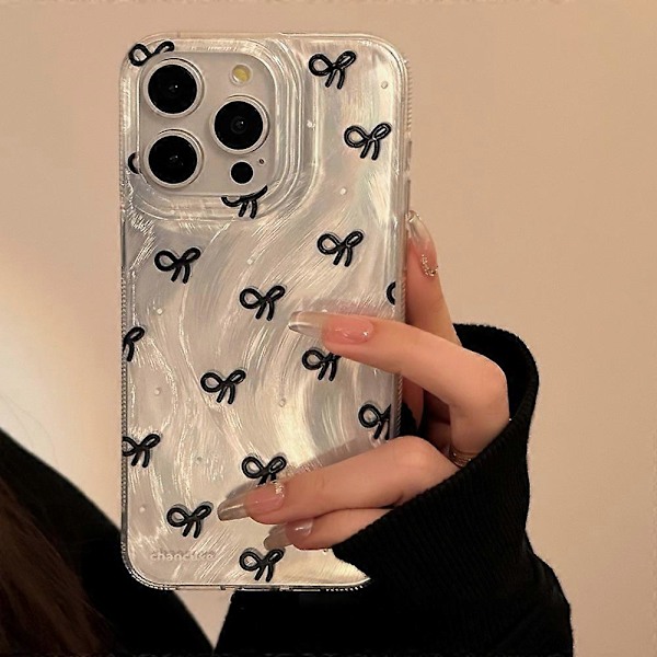 iPhone 15 Pro -kotelo, jossa rusettikuvio ja pehmeä TPU-puhelinkuori