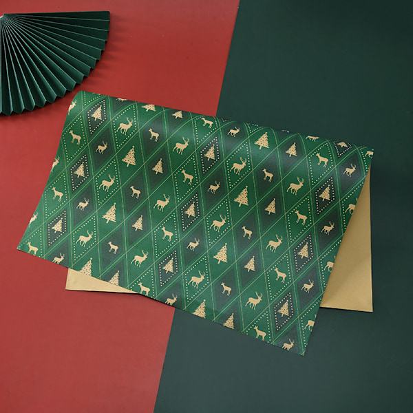 8-pack med 8 mönster julpapper Tomte