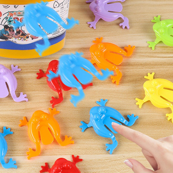 12st färgglada groda hoppande leksaker Fingerpressande hoppande grodor med hink Barn studsande set Presentförpackning