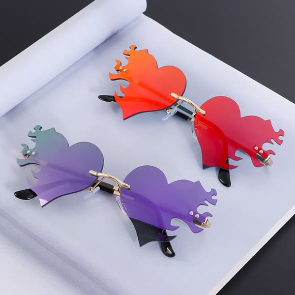 Hjerteformede solbriller for kvinner, rammeløse, UV400-beskyttelse rode