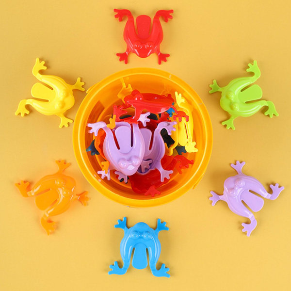 12st färgglada groda hoppande leksaker Fingerpressande hoppande grodor med hink Barn studsande set Presentförpackning