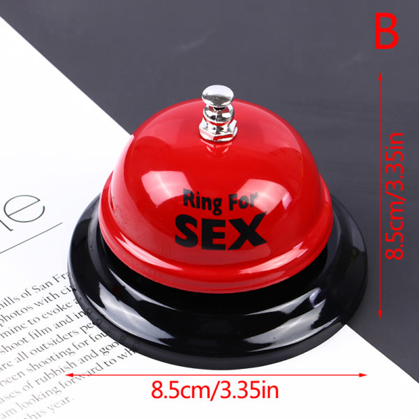 Röd metallklocka med ring i hånden Manuell rattle sex for ring B
