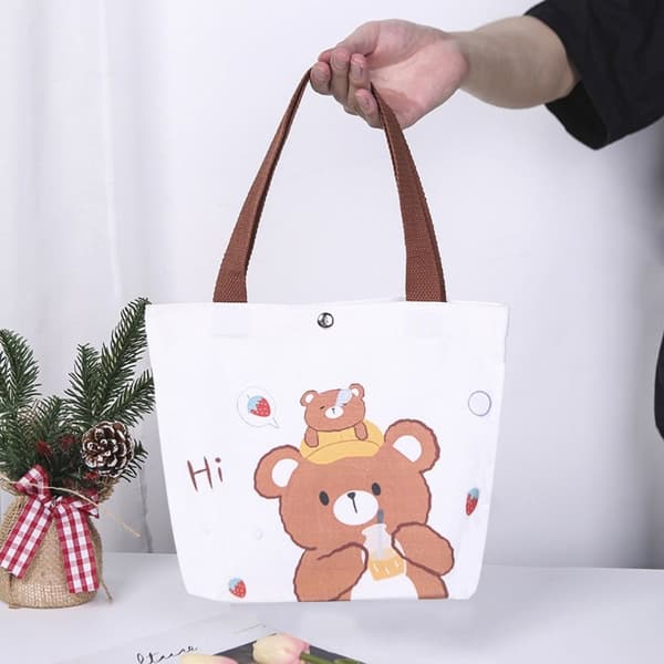 Axelväska med tecknat tryck i canvas 2 2 2