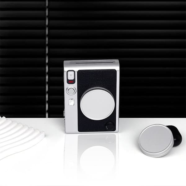 Linsebeskyttelse for instantkamera, svart Black
