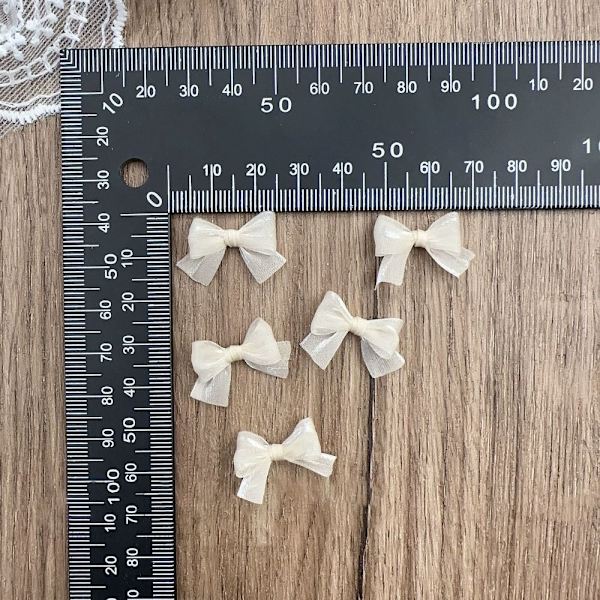 10 kpl Pearlescent Lanka Bow Nail Art Decoration BEIGE beige