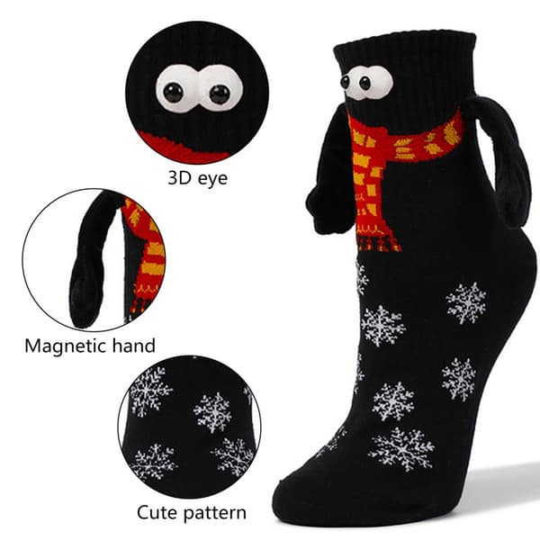 1 par roliga magnetiska julstrumpor som håller hand