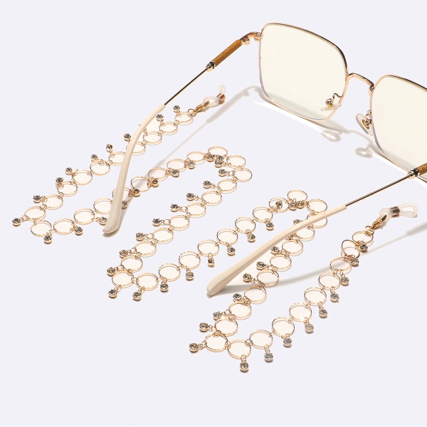 Häpnadsväckande kristall Rhinestone utsmyckad guldfärgad designermode glasögon kedjeremshållare, 27"