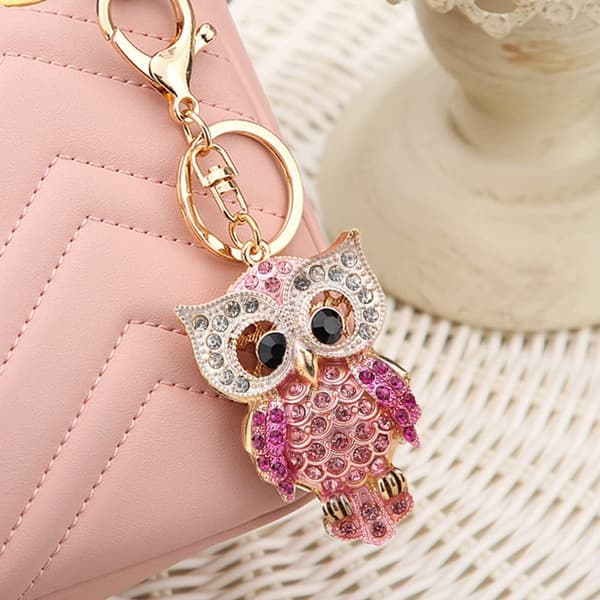 Mote nøkkelring med strassugle, gullfarget glitrende legering, rosa