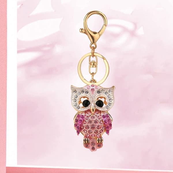 Mote nøkkelring med strassugle, gullfarget glitrende legering, rosa