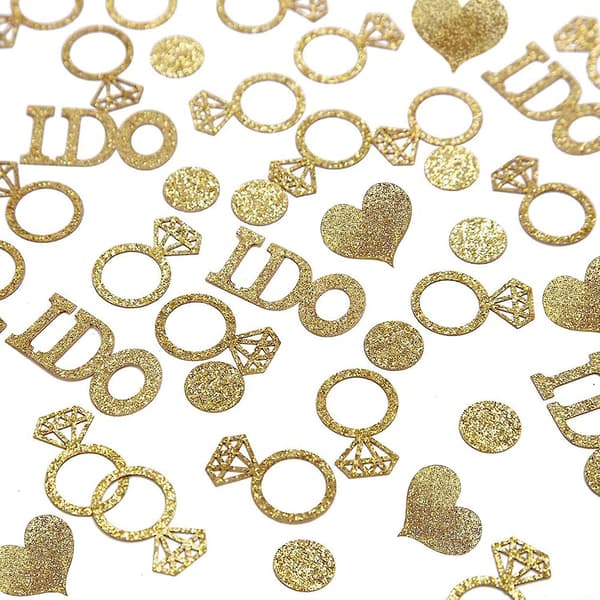 Guldbröllopsbordsdekorationer, glitterpapper diamantring, i do och hjärtkonfetti för bröllopsdusch